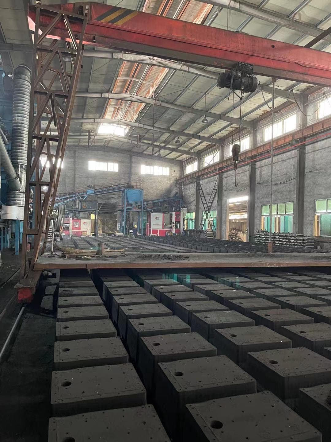 Cast iron weights arranged in a foundry production area