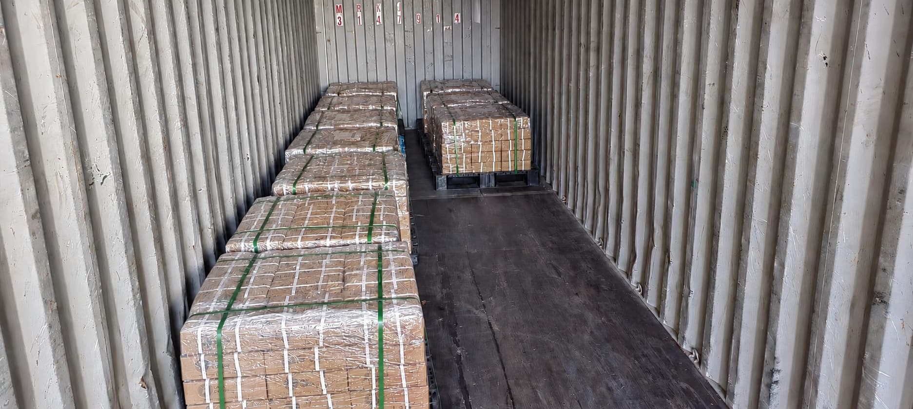 Palletized products prepared inside a shipping container