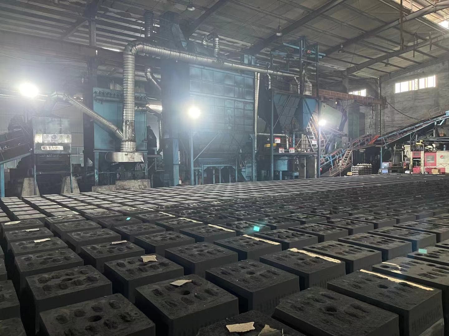 Cast iron weights arranged in a foundry production area