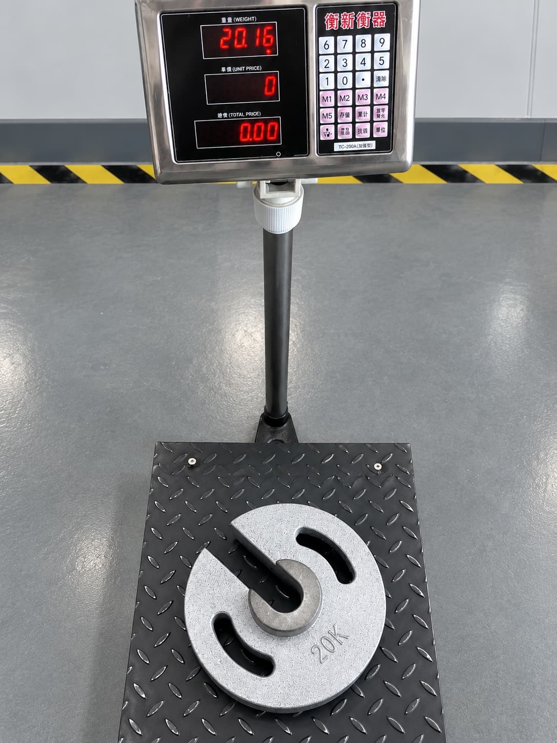 Cast iron weight on a digital scale for weight verification