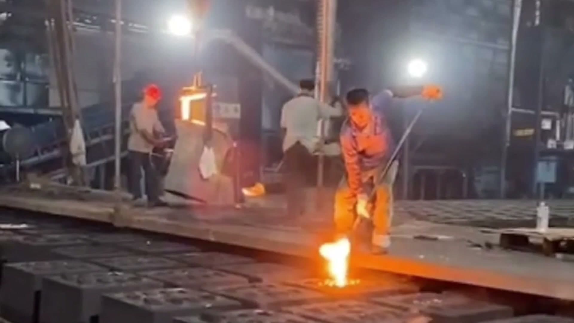 Worker finishing cast iron products in the factory
