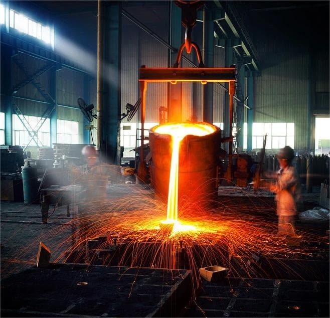 Molten metal pouring during cast iron manufacturing