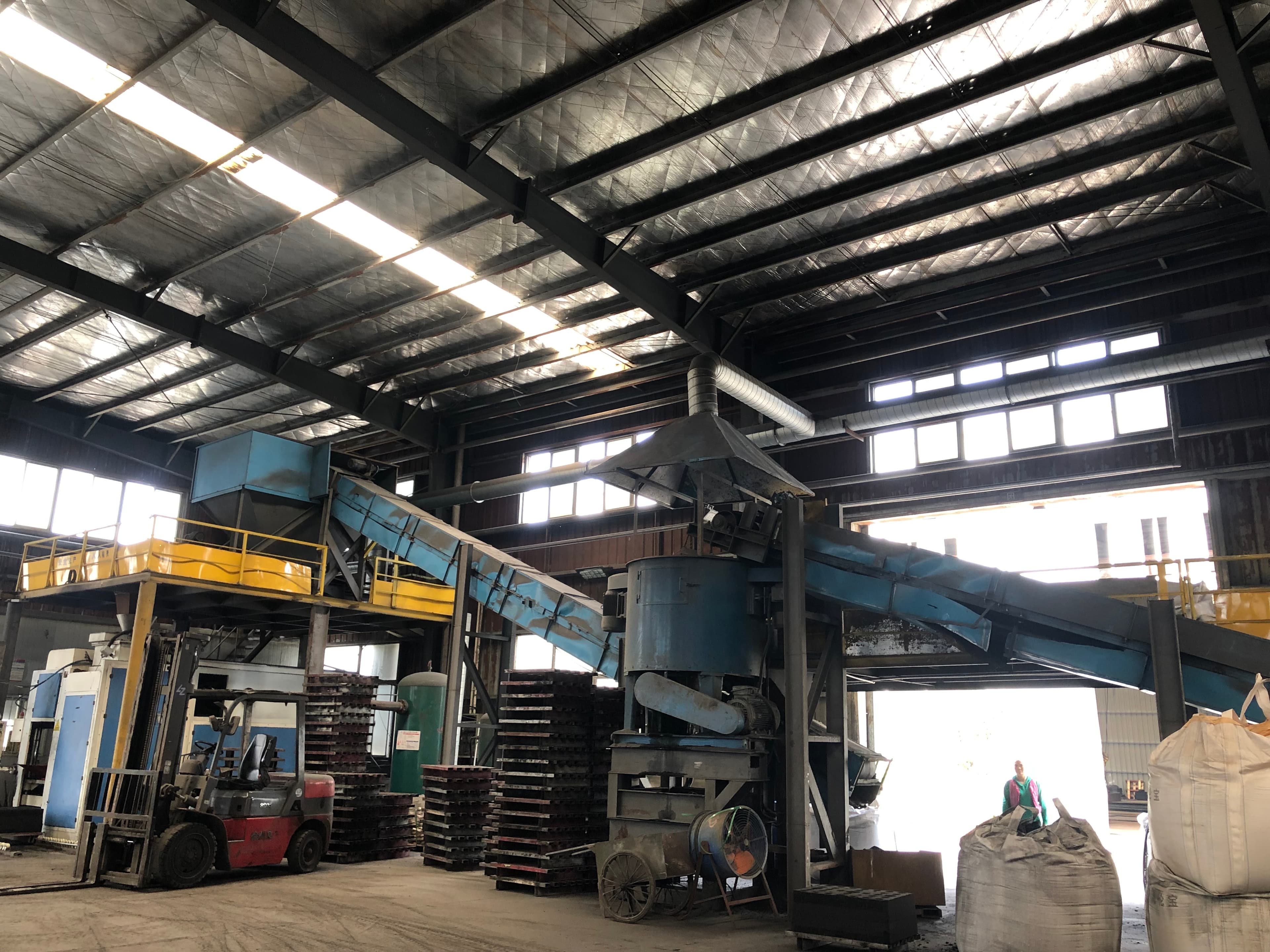 Factory workshop with production equipment and materials
