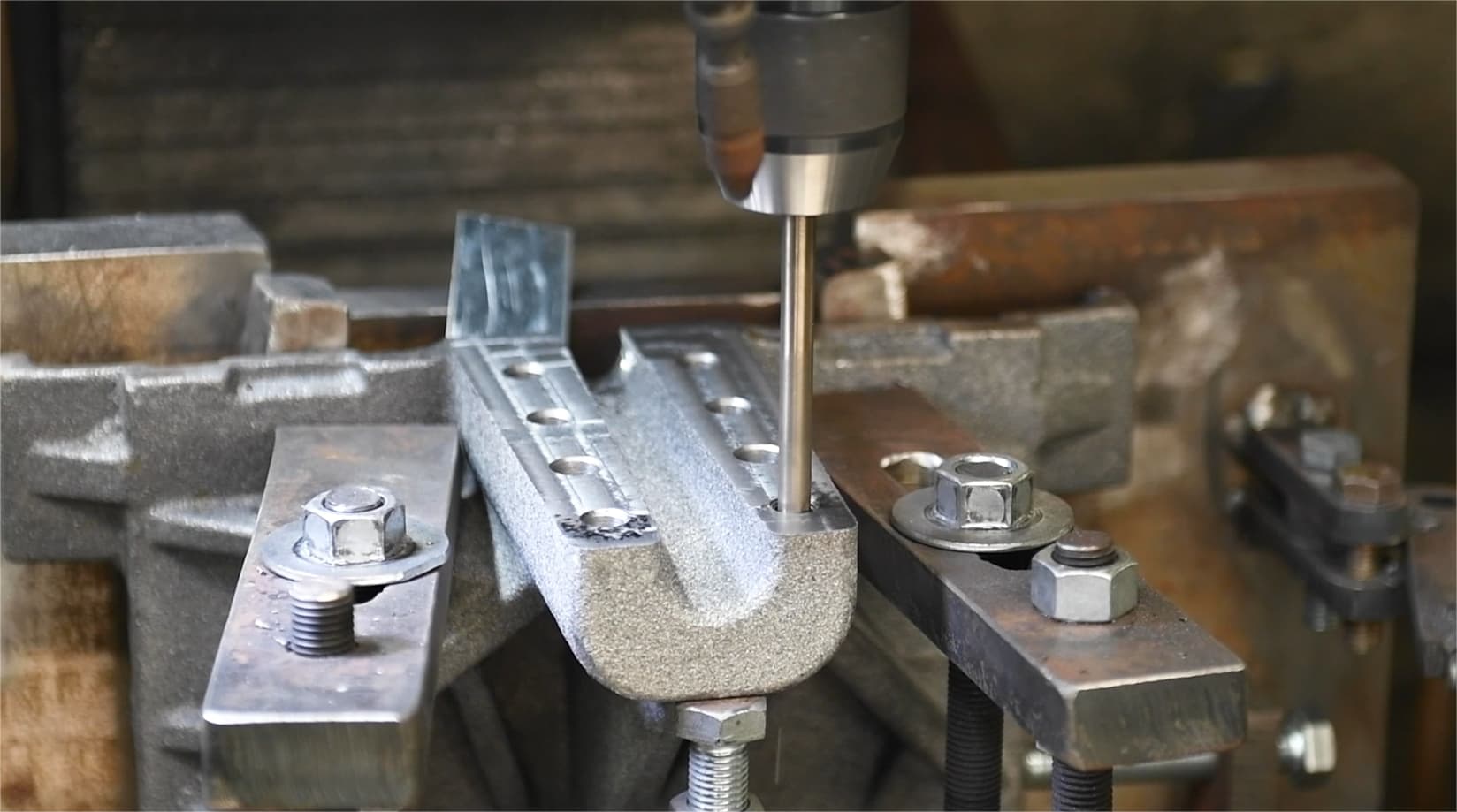 Industrial component being machined in a factory fixture