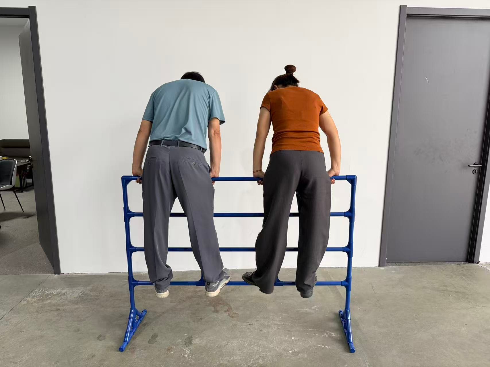 Two people standing on an Event Fence during development load evaluation