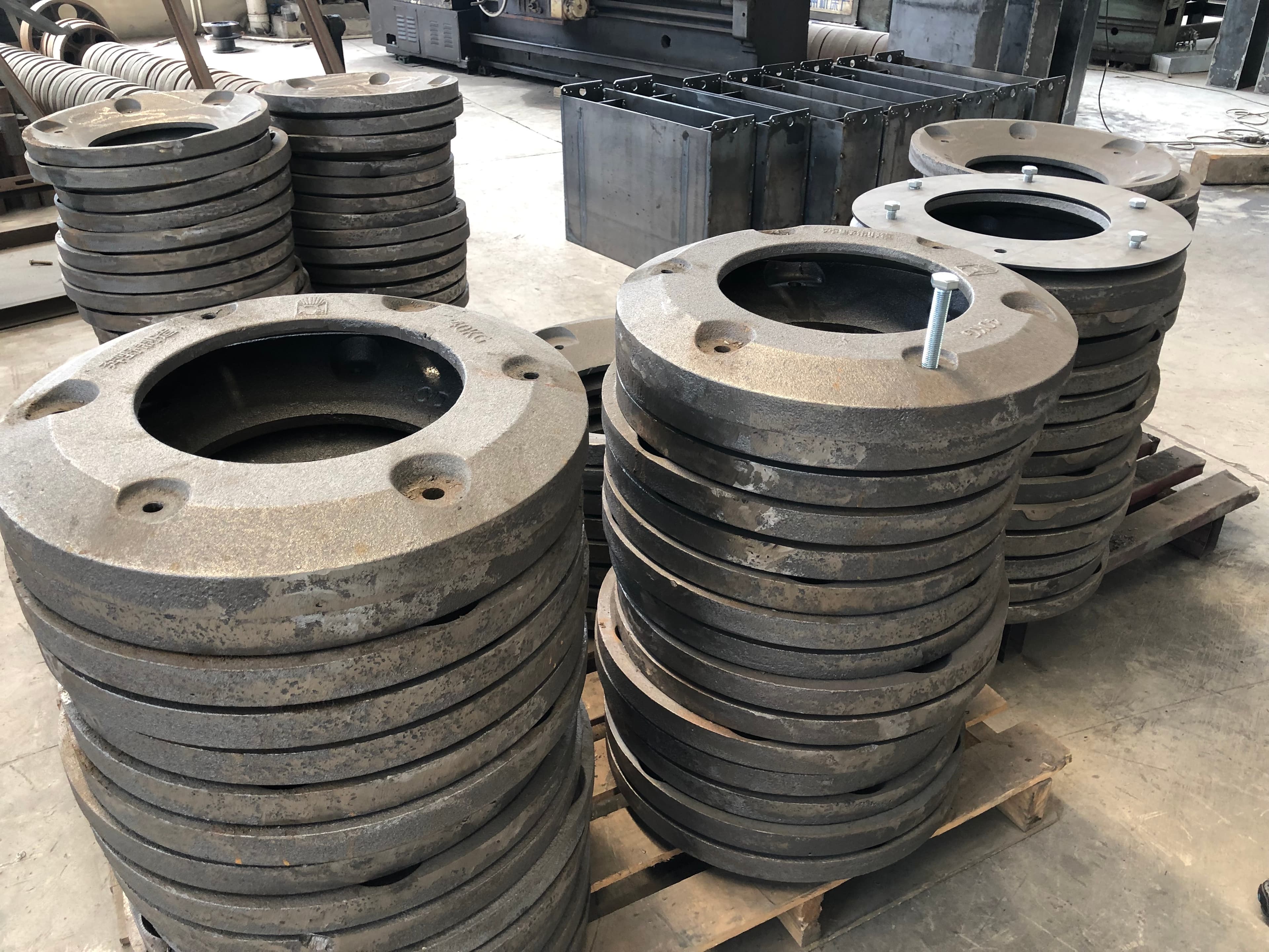 Stacks of circular cast iron counterweight components