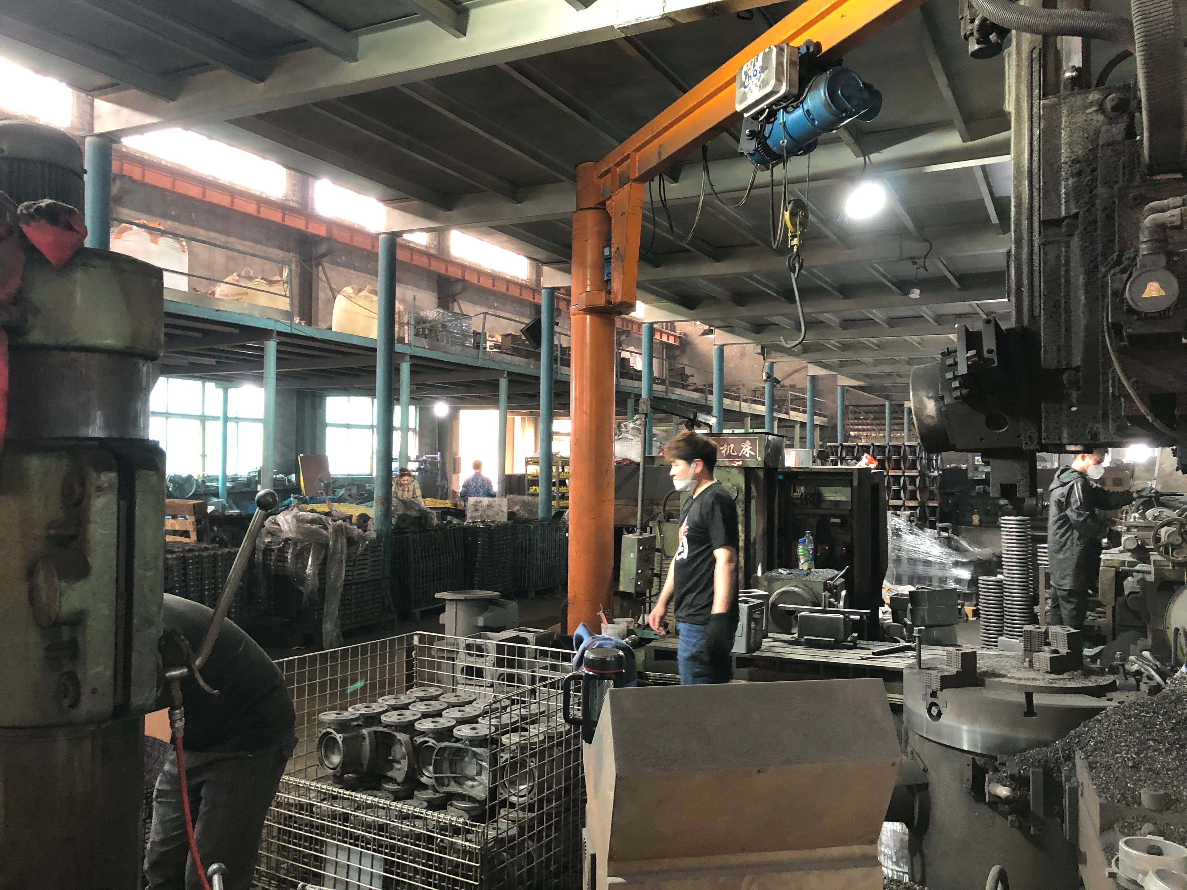 Active production environment with workers and cast products