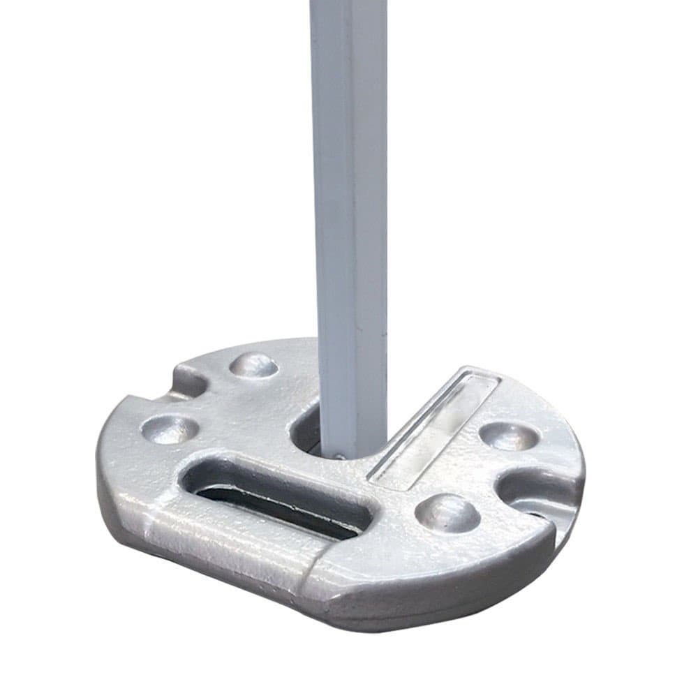 Cast iron tent weight installed around a tent leg
